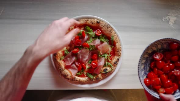 Putting Cherry Tomatoes on Healthy Pizza