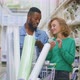Young Multiethnic Couple in Diy Store Use Smartphone Checking Goods - VideoHive Item for Sale