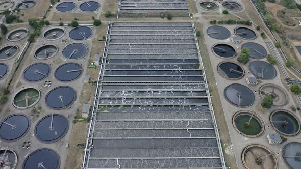 Aerial Flying Over of a Water Treatment Plant Facility. Aeration Station. Round Sedimentation Tanks