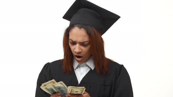 Dissapointed African American Female Graduate Counting Dollars and Doesn't Understand What's Going