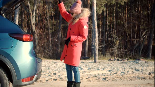 Woman Puts Suitcase In Car. Tourist Travelling Mood. Woman Walking With Yellow Travel Bag Luggage.