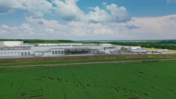 Flight over modern factory. Aerial view of large industrial factory