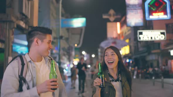 Asian attractive couple drinking alcohol and having party together.