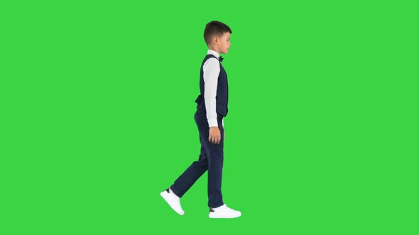 Little Boy Waistcoat Bow Tie Walking Looking Straight Ahead Green Screen Chroma Key