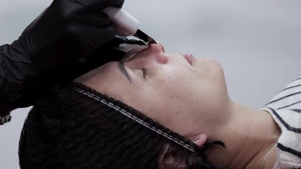 Young woman receiving ultrasound cavitation facial peeling cleansing