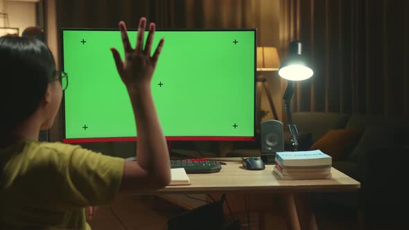 Asian Girl Learning Online, Raising Hand Distance With Mock Up Computer Green Screen