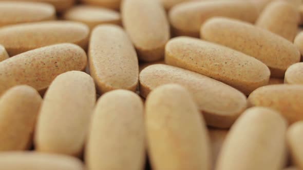 Rotation Of The Vitamin Pills Closeup