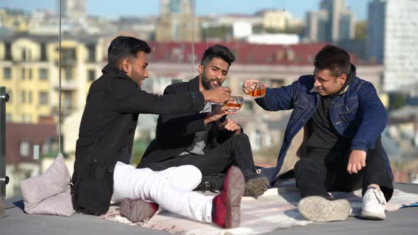 Wide Shot Relaxed Middle Eastern Groom Celebrating Bachelor Party with Friends on Rooftop
