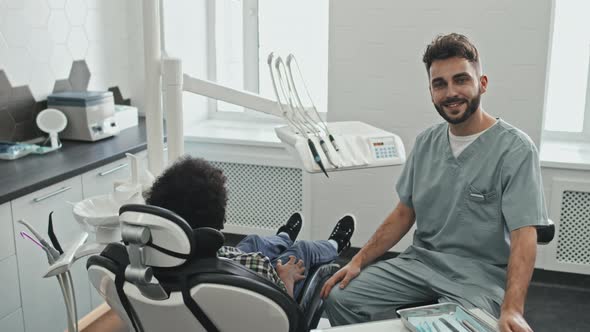 Doctor Posing on Dentist Stool