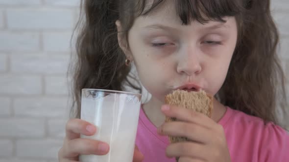 Child with milk and bread