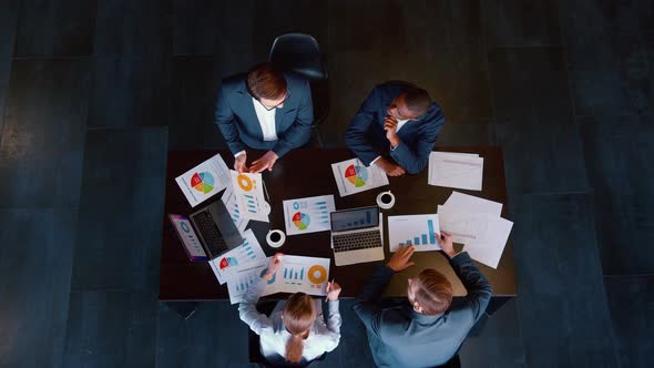 Successful people in suits at a business meeting