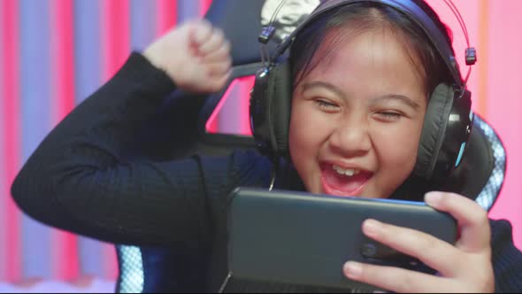 Little Gamer Girl Using Her Smartphone Win The Mobile Game