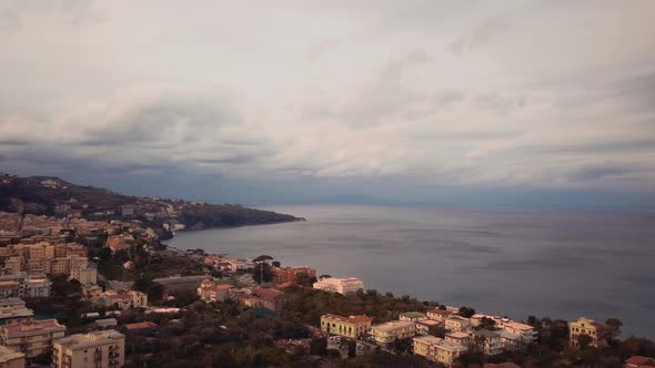 Bird's view from above of the coastal town of Sorrento in Italy, a beautiful landscape of houses nea