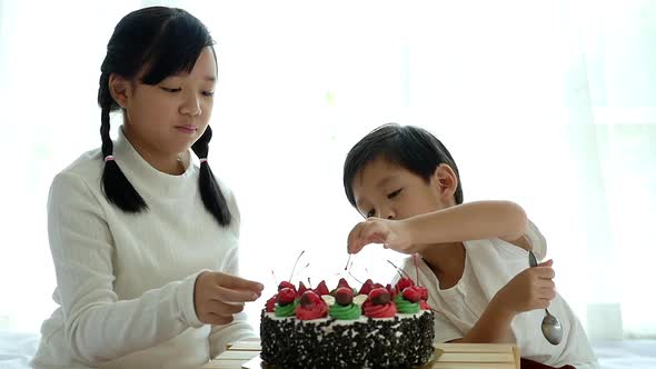 Asian Children With Birthday Cake