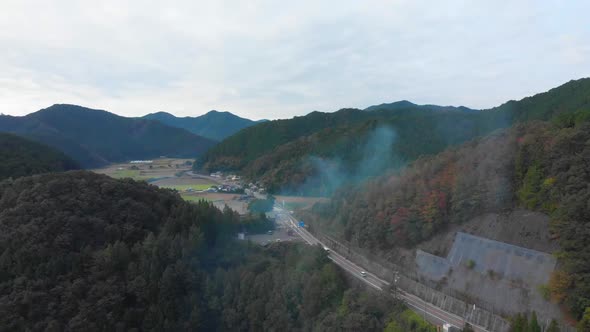 flying over a misty mountain road in japan