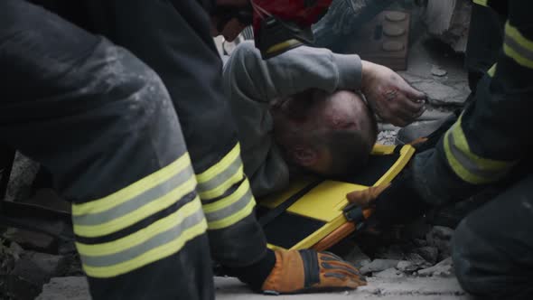 Rescuers Saving Senior Man After Earthquake