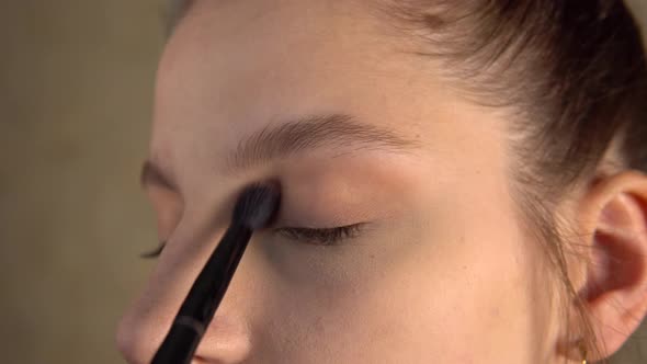 Makeup Artist Put Eyeshadow on Model
