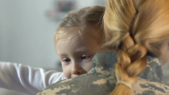 Happy Daughter Hugging Mother in Military Uniform, Family Relations, Homecoming