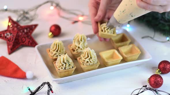 Making Christmas appetizers with savory seafood mousse