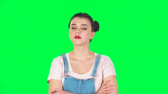 Lovely Girl Listens Carefully To Boring Information and Looks Around on Green Screen, Slow Motion