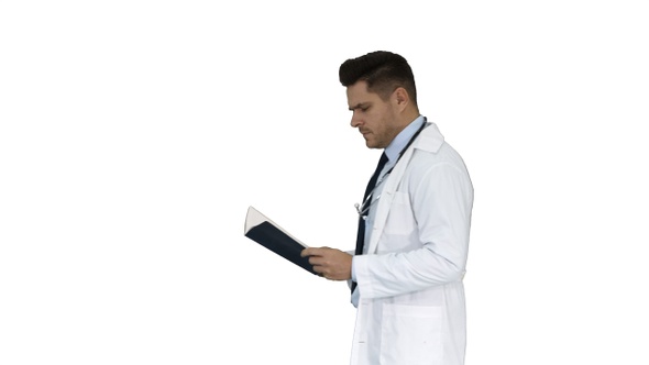 Concentrated medical doctor reading documentation while