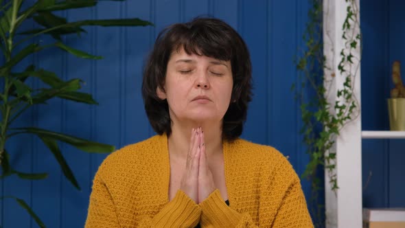 Middle Aged Woman Asking for Help Concerned About Problem or Concentrating Mind at Work Religious alt