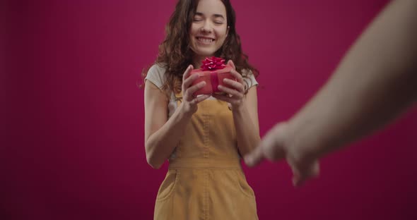 Young Beautiful Happy Girl Accepting Presents