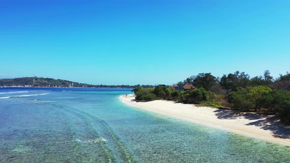 Natural overhead abstract shot of a sunshine white sandy paradise beach and blue water background in