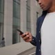 Ethnic Man Using Smartphone on Street - VideoHive Item for Sale