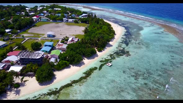 Aerial drone seascape of relaxing lagoon beach lifestyle by turquoise sea and clean sandy background