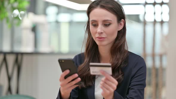 Close Up of Online Payment on Smartphone By Businesswoman 