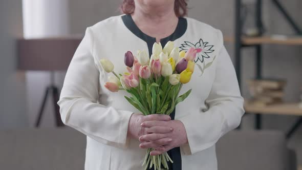 Bouquet of Tulips in Female Senior Caucasian Hands