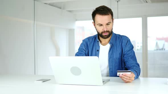 Beard Young Man Buying Online On Laptop Payment