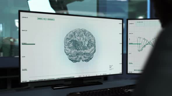 Doctor Oversees Patients Head Examination In Innovative Medical Software