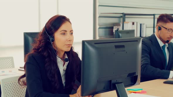 Business People Wearing Headset Working in Office