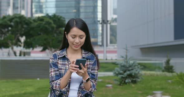 Young woman use of mobile phone at outdoor