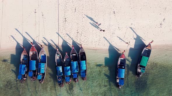 Amazing Overhead Aerial View of Long Tail Boats on a Thailand Beach Shoreline