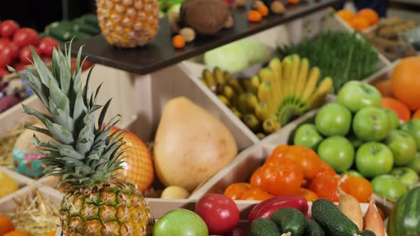 Wooden Box with Vegetables and Fruits on the Counter of the Store