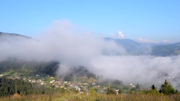 Morning Fog Dissipates in the Mountains Carpathians