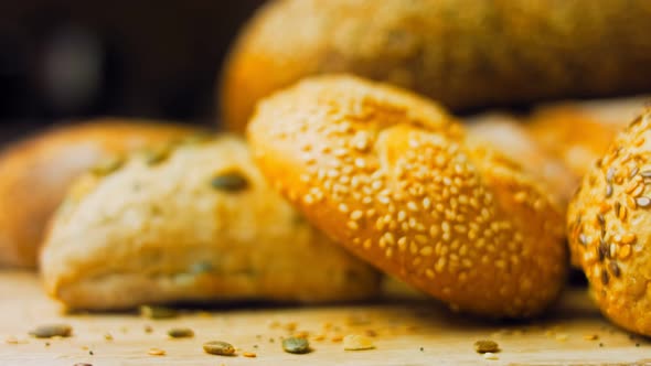 Different Kinds of Fresh Bread on Wooden Table