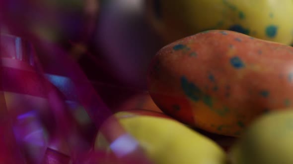 Rotating shot of colorful Easter candies on a bed of easter grass - EASTER 182