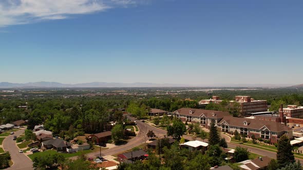 A drone floating over the suburbs and a hospital in the middle of Odgen Utah