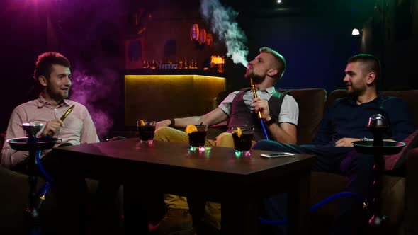 Boys Smoking Hookah in the Lounge Caffee