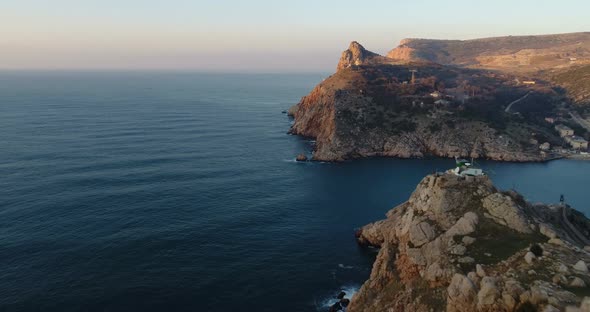 Flying Forward Over the Rocks, Hills and Sea Shore