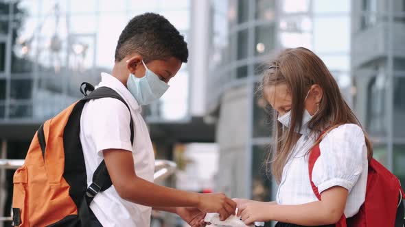 Schoolkids Disinfecting Hands During Coronavirus Pandemic