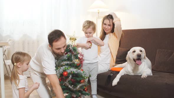 Lovely Family Spend Time Together at Home with Dog