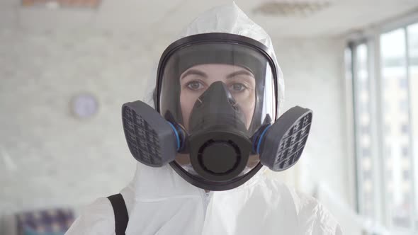 a Woman Employee of a Cleaning Service or the Exterminator Posing at the Camera