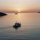 Greece, Kythnos Cyclades island. Aerial drone video of an outbound fishing boat - VideoHive Item for Sale