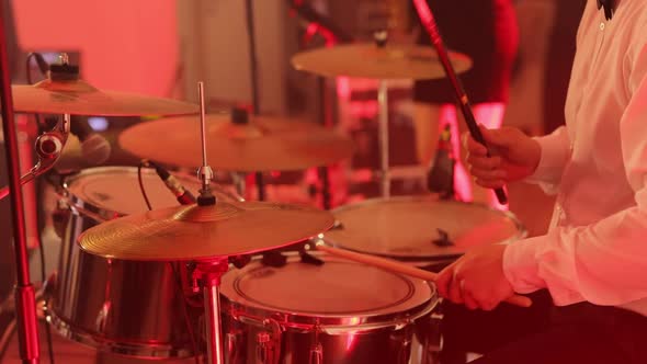 Young Man Playing Drums on Stage Drum Set Drum Kit Drummer Plays