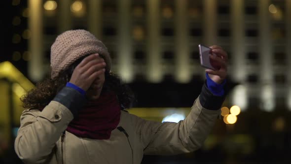 Girl Bringing Herself Up and Making Selfie to Upload It to Social Media Website